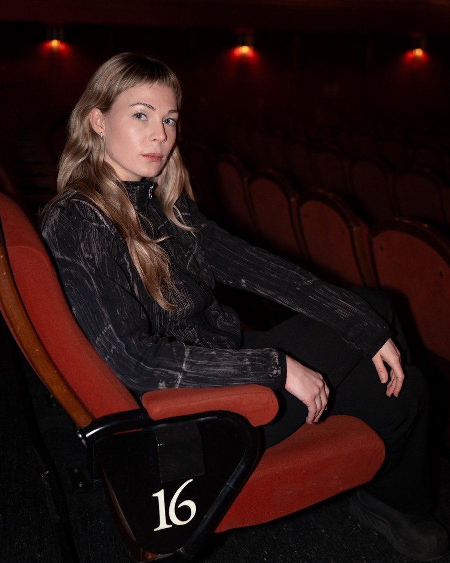 Beatrice Karlsson, programme director of Stockholm International Film Festival, seated in a red cinema chair
